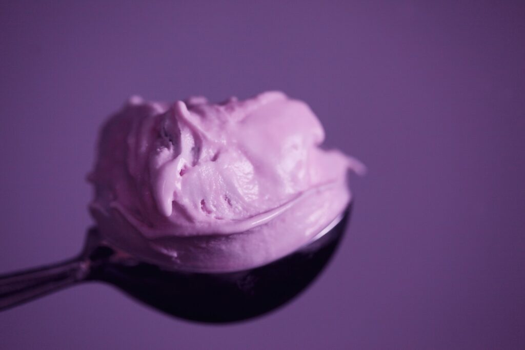 a bowl of ice cream with berries