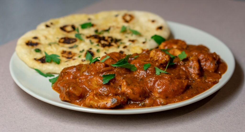 Delight in the Spicy Flavors of Homemade Beef Rogan Josh with Rice and Naan